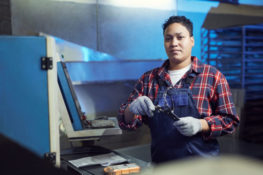 a woman working with machines and tools