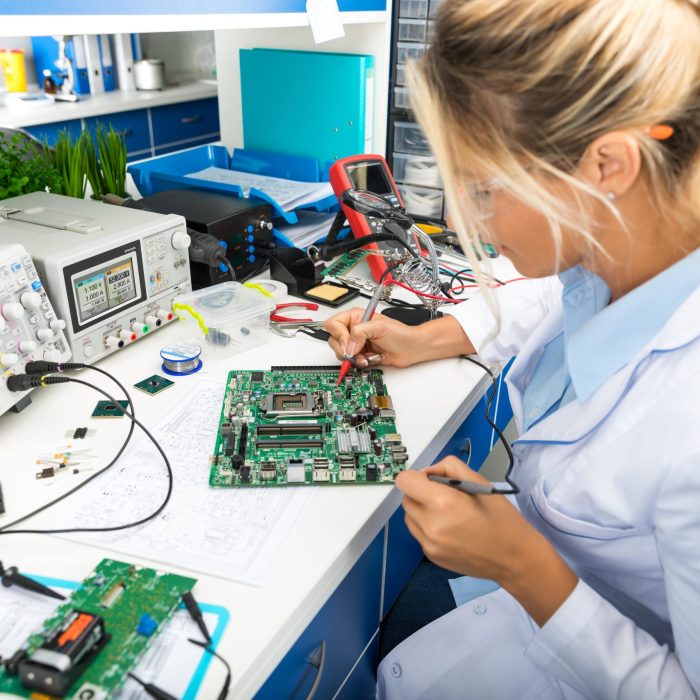 a woman soldering
